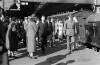 [Eamonn De Valera walking along station platform surrounded by lots of people at Westland Row station, Dublin]