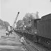 151 train being unloaded by men, Foxrock, Dublin City, Co. Dublin.