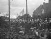 [1906. Crowds lining street as cavalry passes.]
