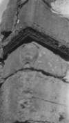 The Abbot's Head, carved on a brown sandstone on a corner of the monastery ruins on Innisfallen Island.