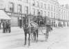 [Lusitania Disaster, Cobh, Co. Cork : horse and cart carrying coffins, with two men seated in cart]